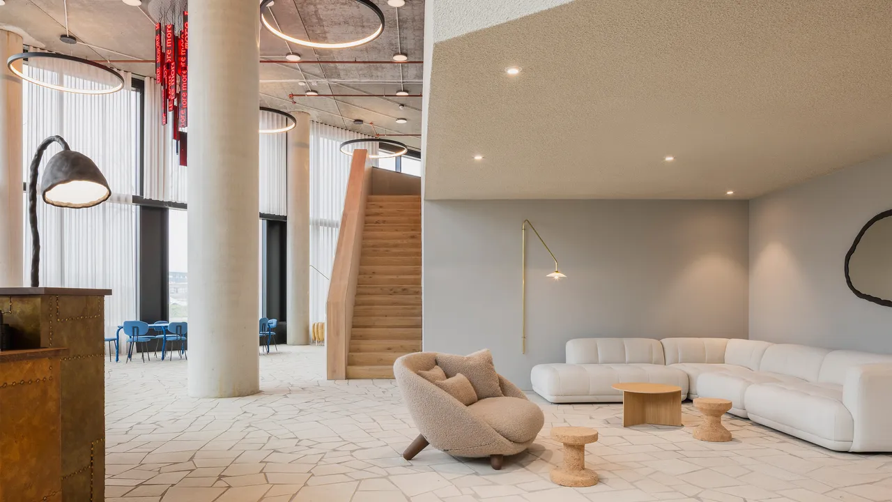 The lobby lounge with sofas beneath the staircase